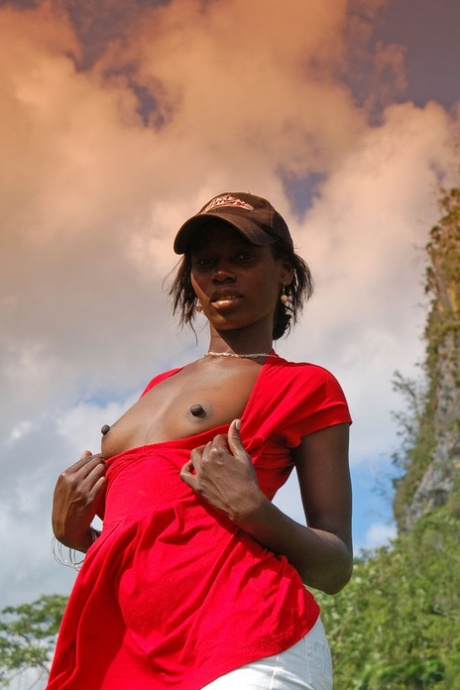 Exotic ebony Maria L strips naked to show her hot chocolate body outdoors