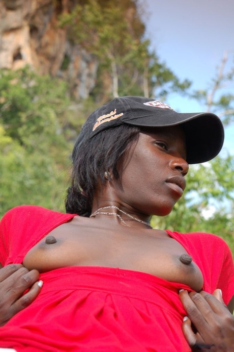 Exotic ebony Maria L strips naked to show her hot chocolate body outdoors