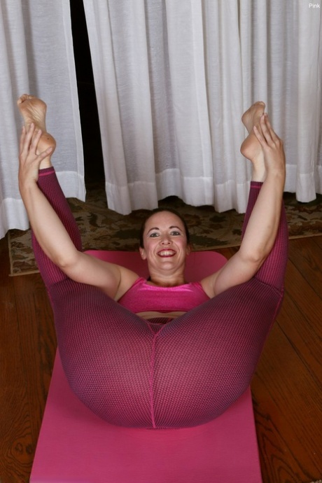 Middle-aged lady showcases her hairy vagina while doing yoga