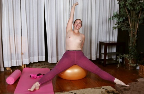 Middle-aged lady showcases her hairy vagina while doing yoga