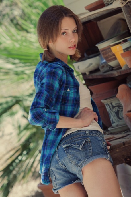 Beautiful girl Bonnie uncovers her tiny tits before showing her trimmed bush