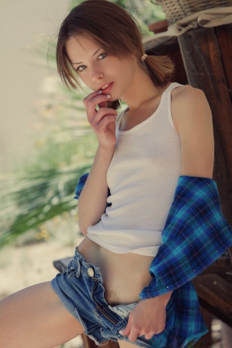 Beautiful girl Bonnie uncovers her tiny tits before showing her trimmed bush