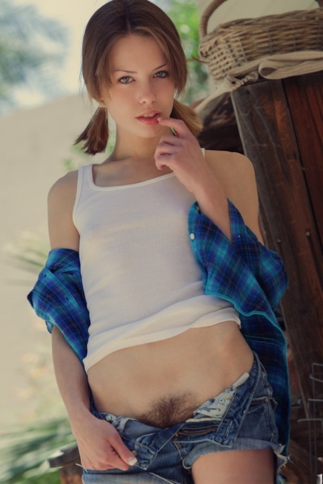 Beautiful girl Bonnie uncovers her tiny tits before showing her trimmed bush