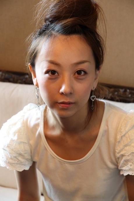 Cute Japanese girl Kinomi gets totally naked with her hair put up