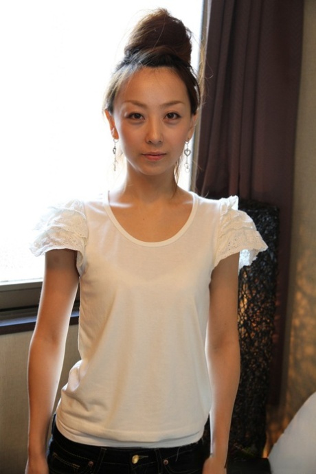 Cute Japanese girl Kinomi gets totally naked with her hair put up