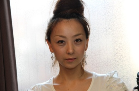 Cute Japanese girl Kinomi gets totally naked with her hair put up
