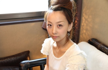 Cute Japanese girl Kinomi gets totally naked with her hair put up