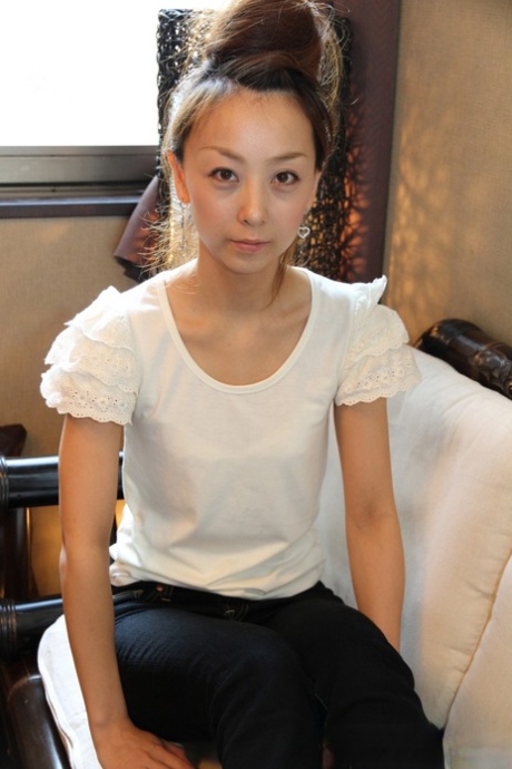 Cute Japanese girl Kinomi gets totally naked with her hair put up