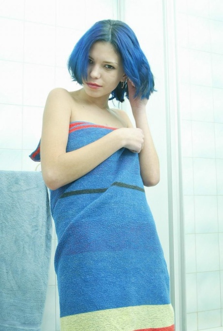Blue haired amateur teen Katty rubs her shaved vagina in the shower